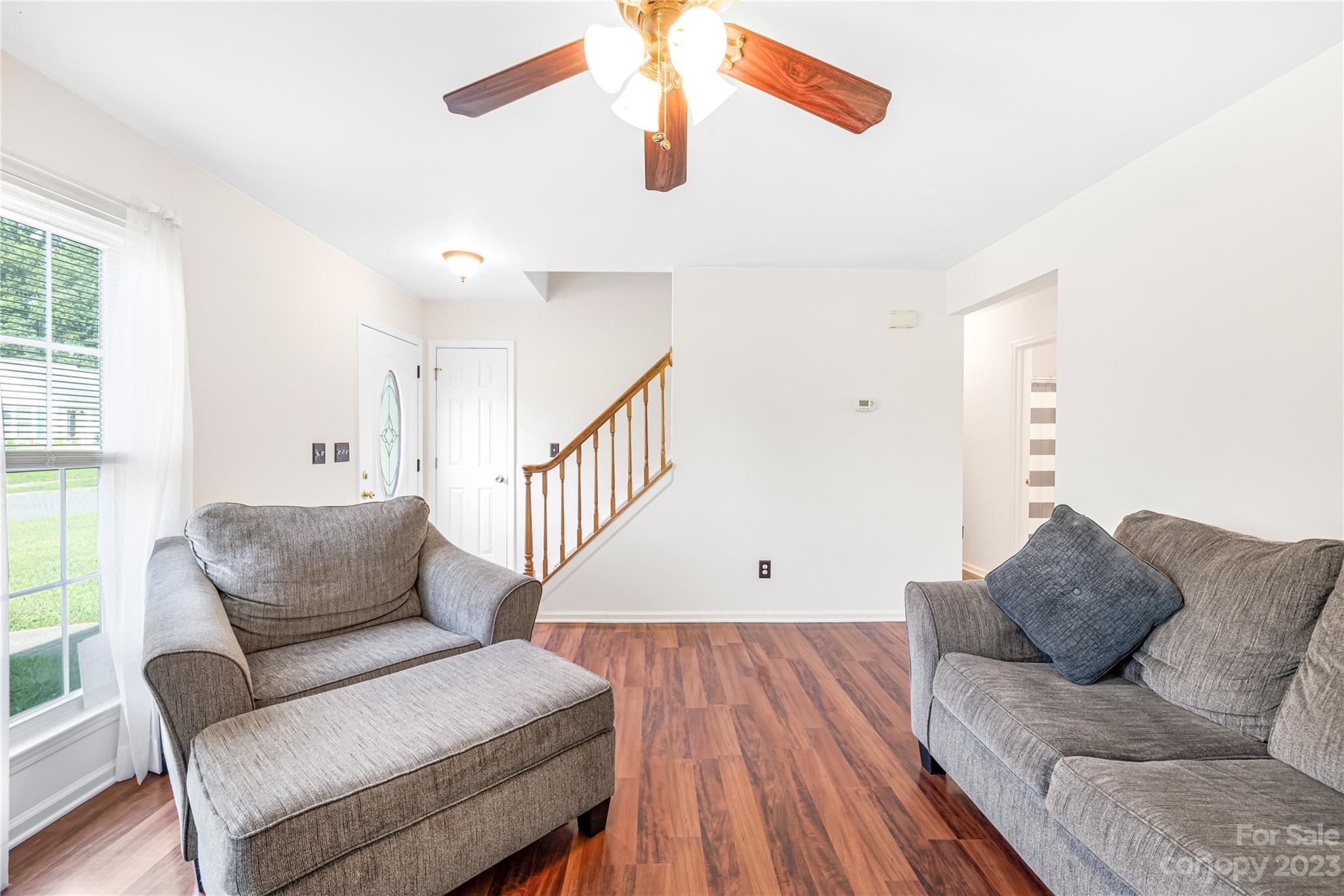 9504 Foggy Meadow Road Charlotte, NC 28269 - Photo 6 of 24 a living room with furniture and a large window