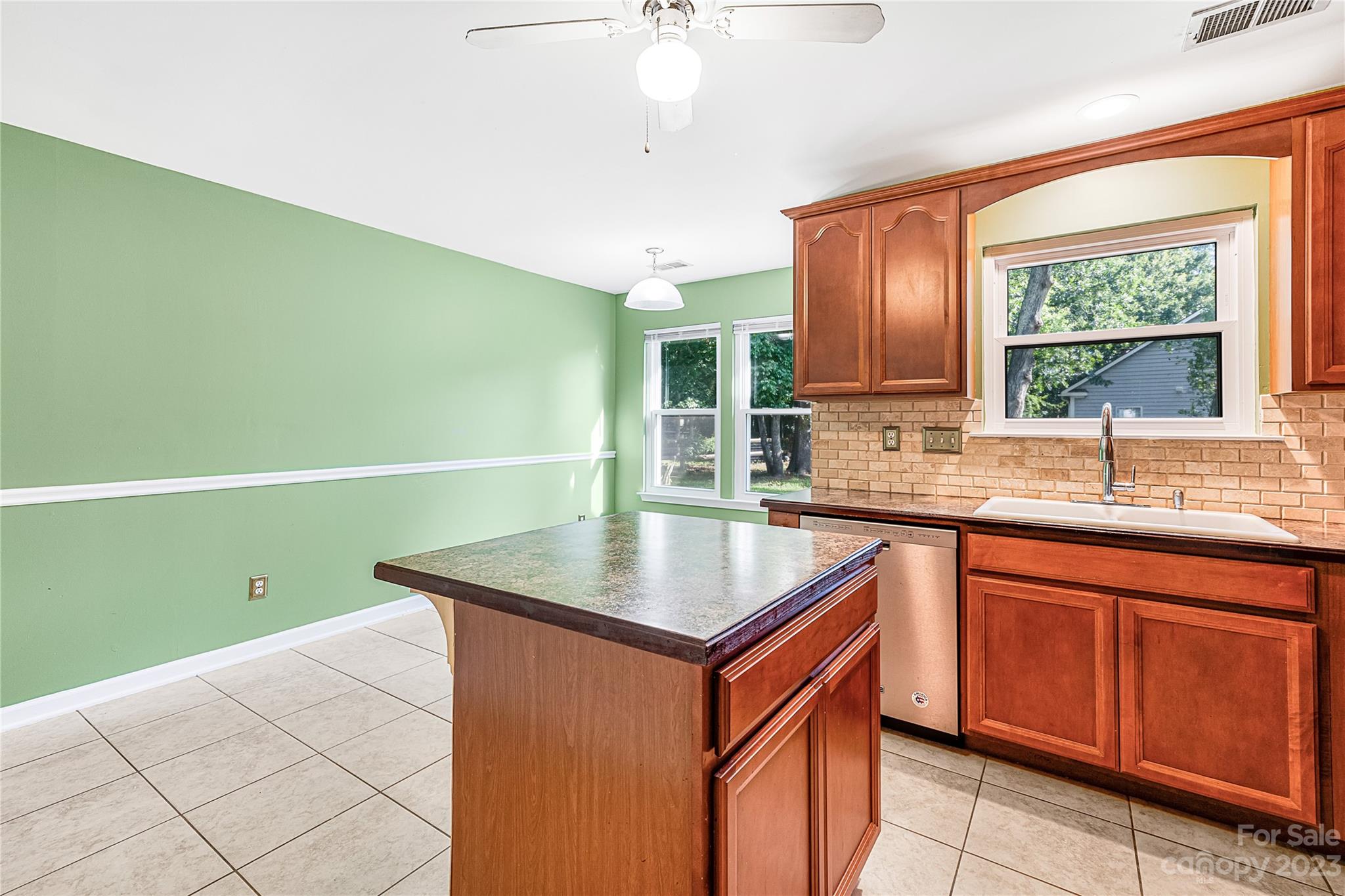9504 Foggy Meadow Road Charlotte, NC 28269 - Photo 9 of 24 a kitchen with a sink cabinets and window
