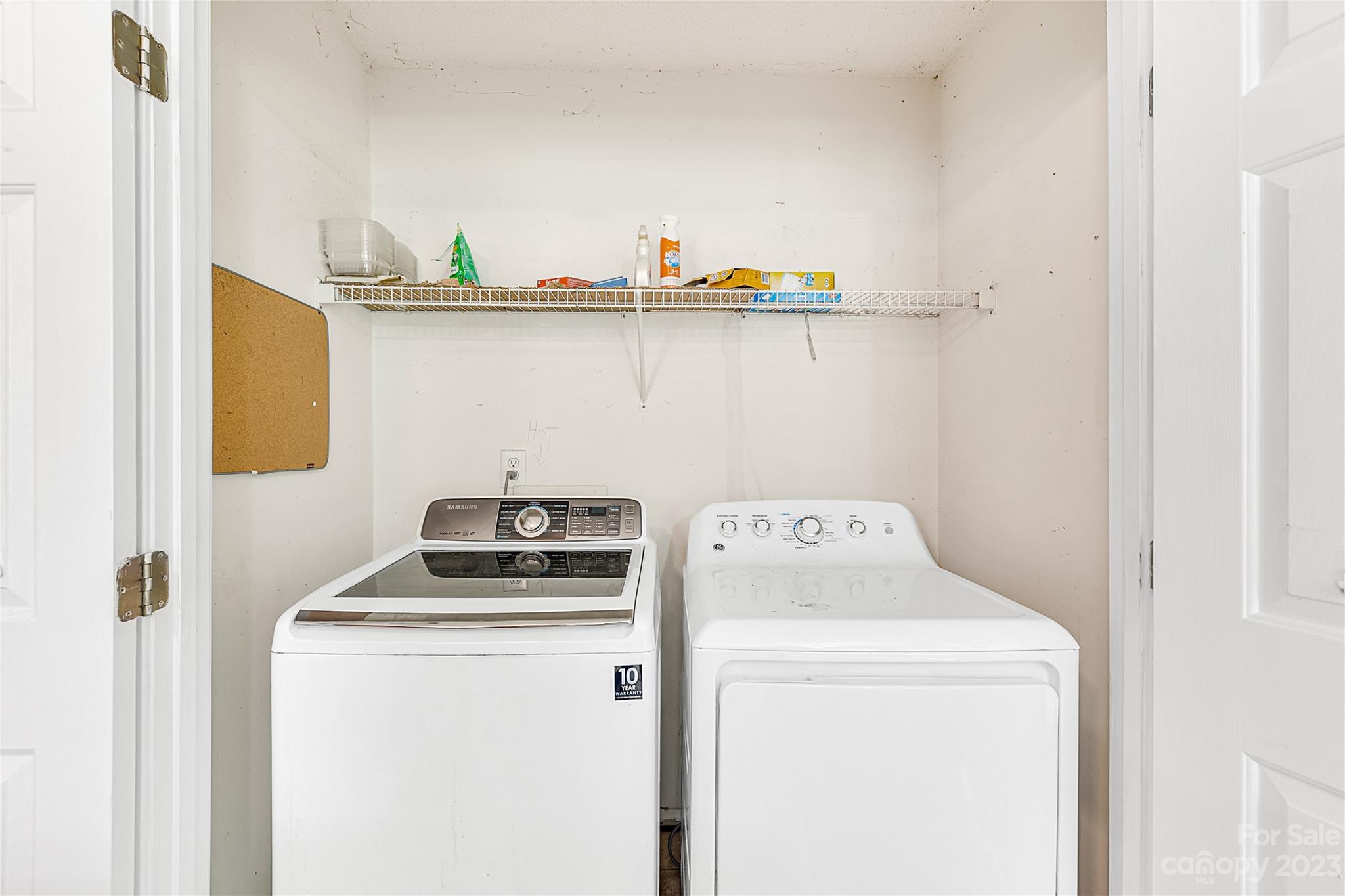 9504 Foggy Meadow Road Charlotte, NC 28269 - Photo 10 of 24 a utility room with dryer and washer