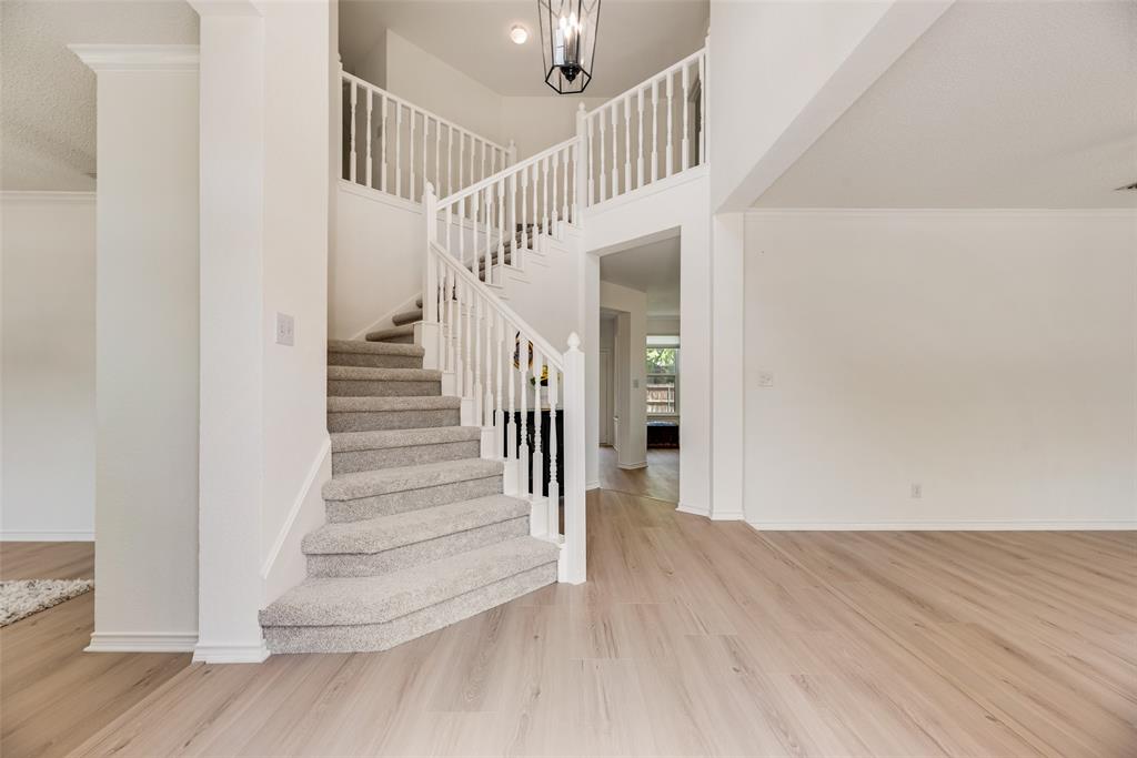 1406 West Peters Colony Road Carrollton, TX 75007 - Photo 2 of 29 a view of entryway and hall with wooden floor