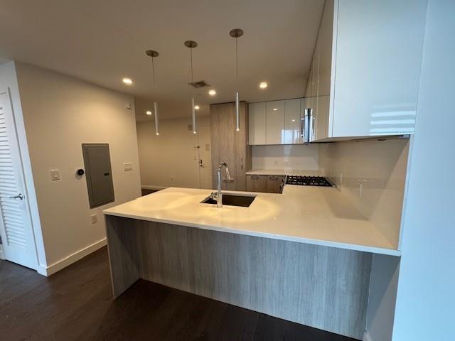 13105 40th Road, Unit 15E Queens, NY 11354 - Photo 12 of 15 a kitchen with a sink and wooden floor