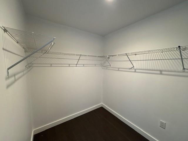 13105 40th Road, Unit 15E Queens, NY 11354 - Photo 5 of 15 a view of a room with racks on the wall