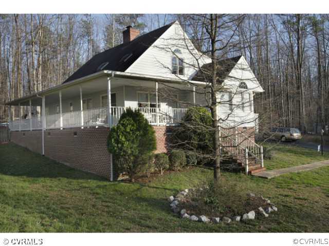 4211 Saratoga Road Richmond, VA 23235 - Photo 1 of 24 a front view of a house with a garden