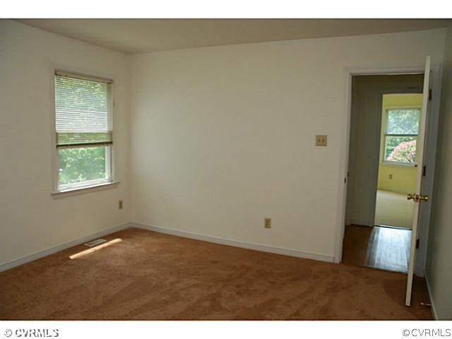 4211 Saratoga Road Richmond, VA 23235 - Photo 19 of 24 a view of an empty room and window