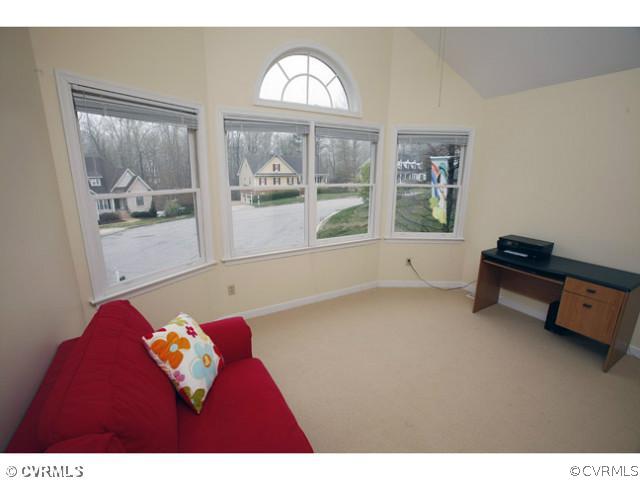 4211 Saratoga Road Richmond, VA 23235 - Photo 20 of 24 a view of a livingroom with furniture window and a wooden floor