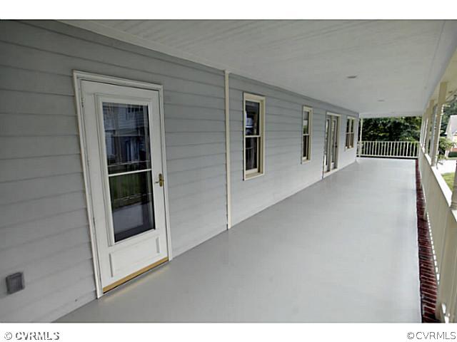 4211 Saratoga Road Richmond, VA 23235 - Photo 2 of 24 a view of empty room with floor to ceiling window and ceiling fan