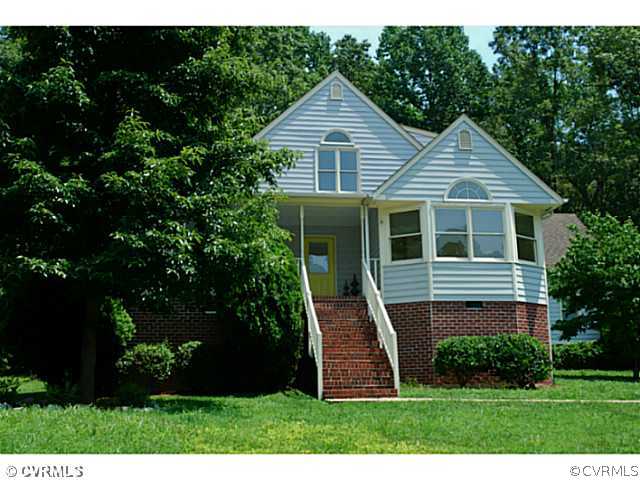 4211 Saratoga Road Richmond, VA 23235 - Photo 23 of 24 a front view of a house with a yard
