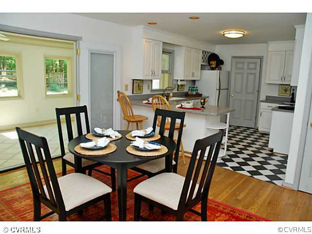 4211 Saratoga Road Richmond, VA 23235 - Photo 9 of 24 a view of a dining room with furniture