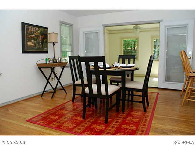 4211 Saratoga Road Richmond, VA 23235 - Photo 10 of 24 a view of a dining room with furniture and wooden floor