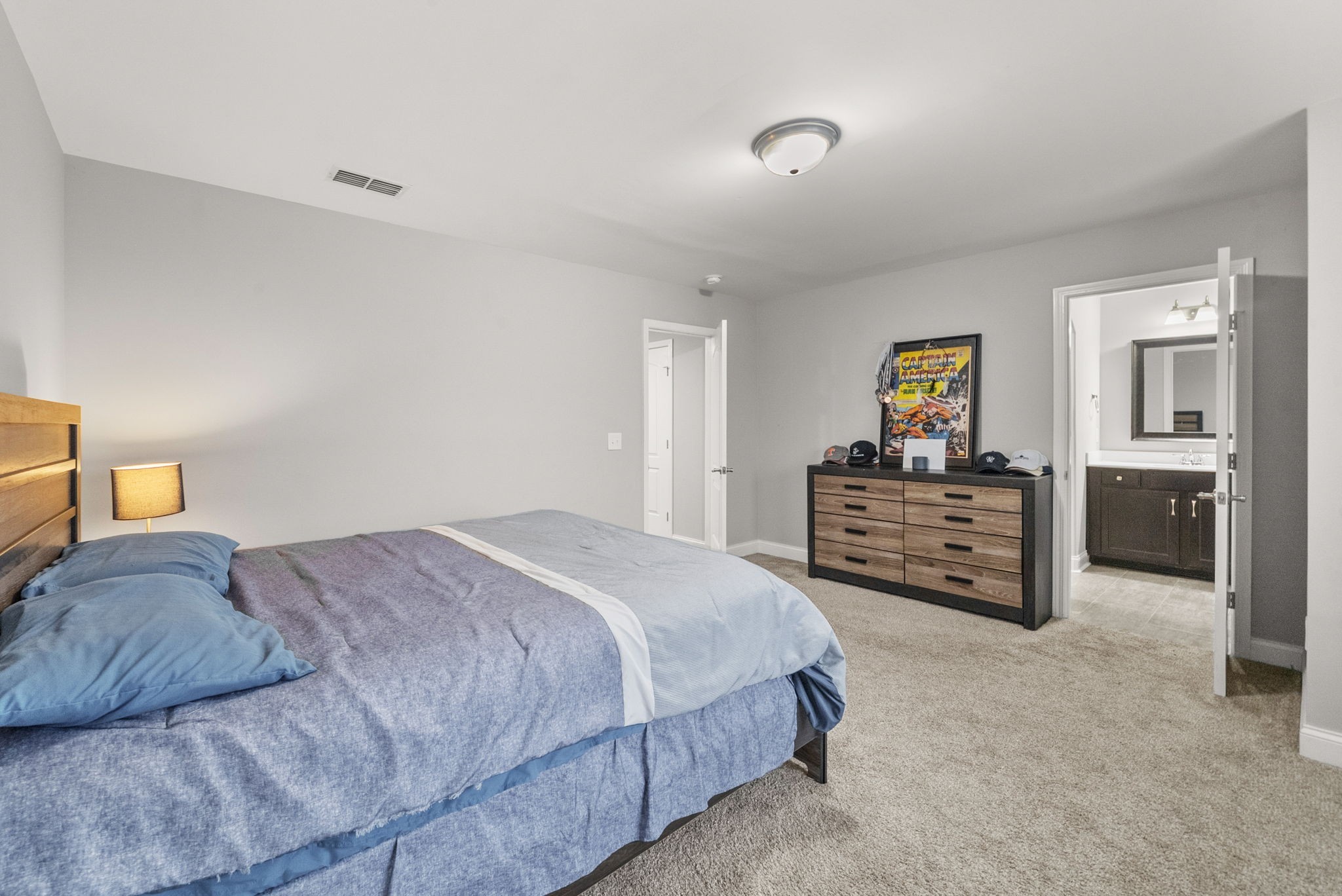 1102 Marys Place Lebanon, TN 37090 - Photo 28 of 58 a bedroom with a bed and a chandelier