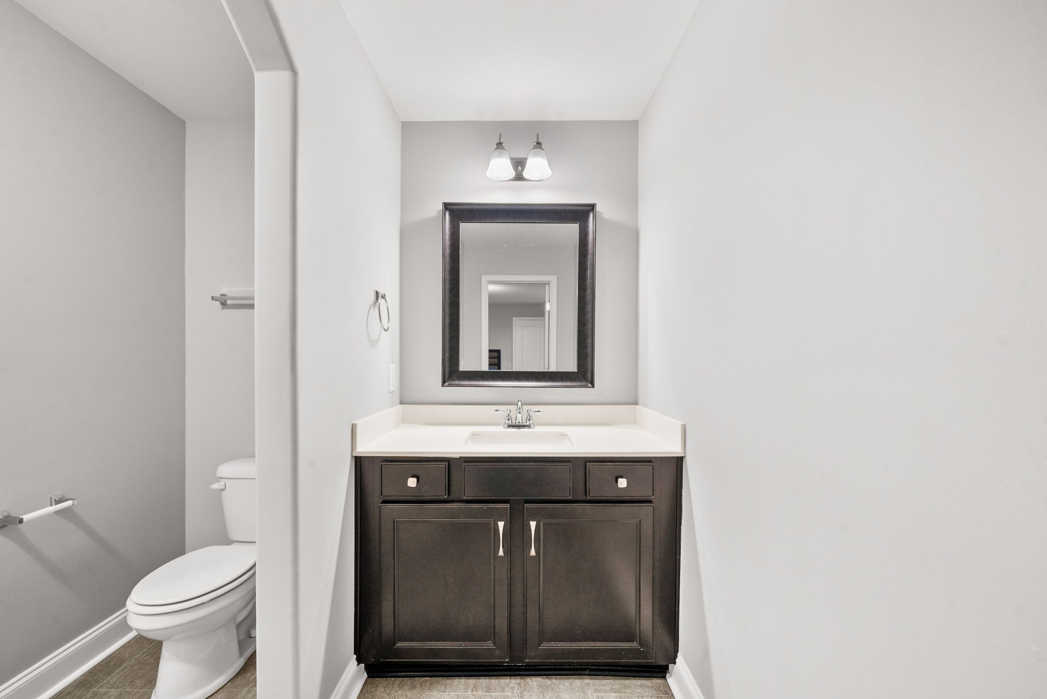 1102 Marys Place Lebanon, TN 37090 - Photo 29 of 58 a bathroom with a granite countertop toilet sink and mirror
