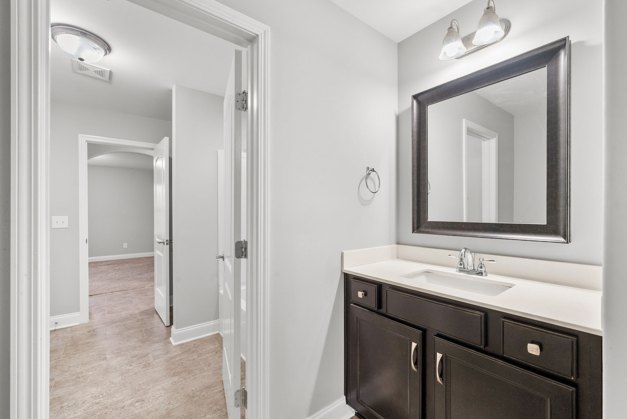1102 Marys Place Lebanon, TN 37090 - Photo 40 of 58 a bathroom with a sink vanity and a mirror