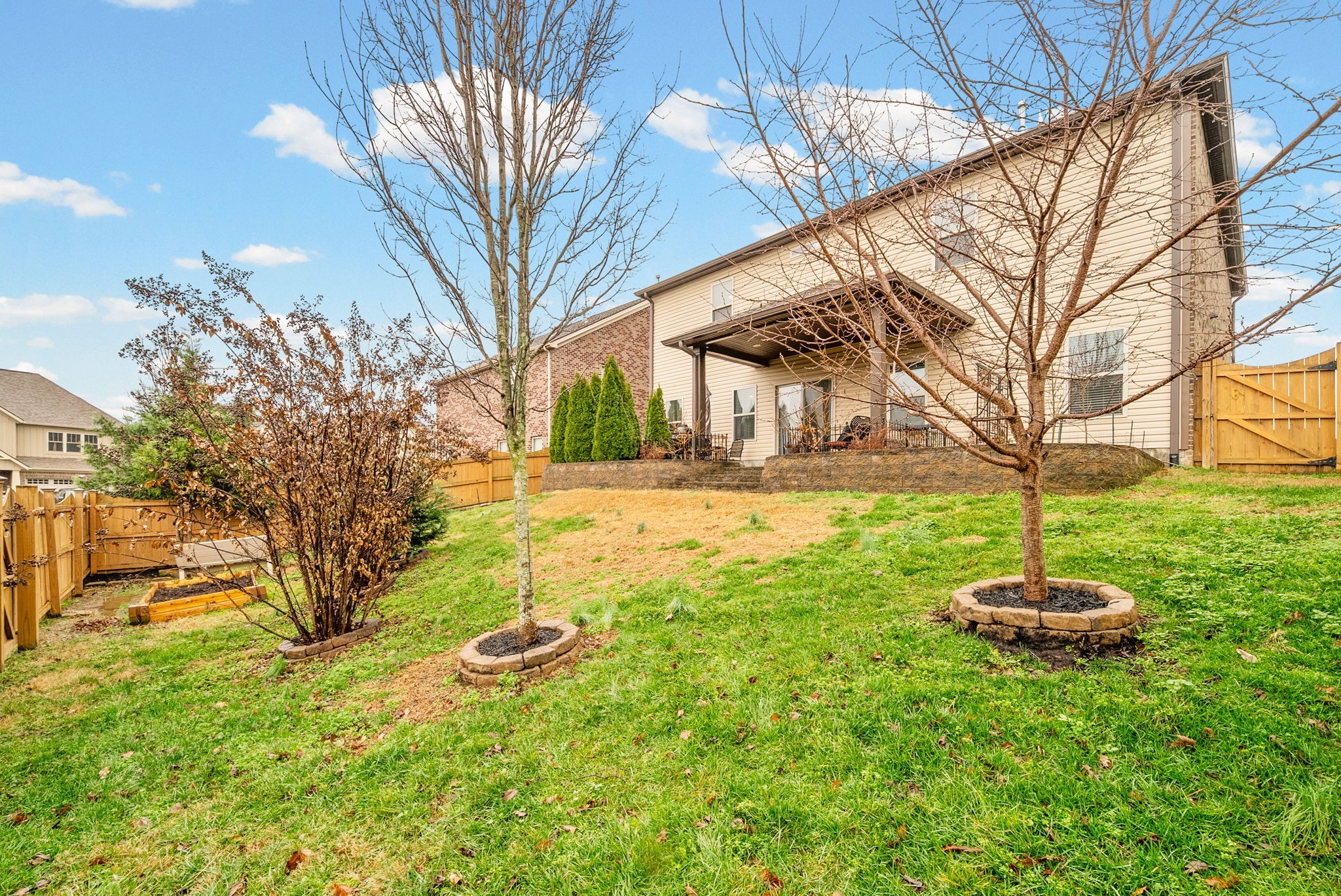 1102 Marys Place Lebanon, TN 37090 - Photo 45 of 58 a backyard of a house with fountain table and chairs