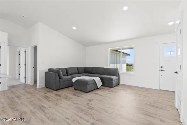 a spacious bedroom with a bed and a couch