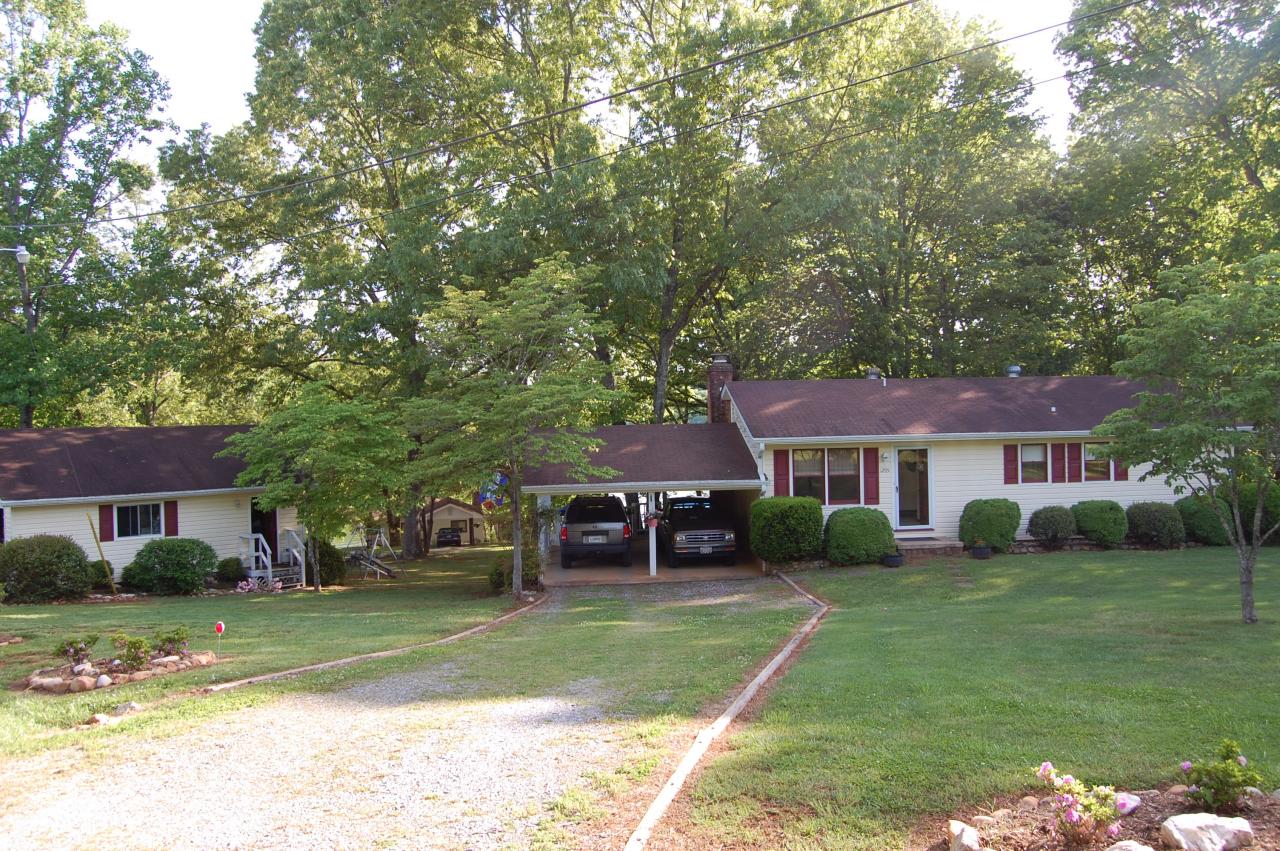 1295 Loggers Road Goodview, VA 24095 - Photo 4 of 6 a front view of a house with a yard