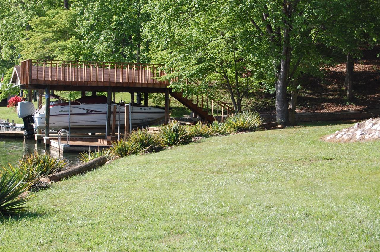 1295 Loggers Road Goodview, VA 24095 - Photo 6 of 6 a view of backyard with deck and outdoor seating