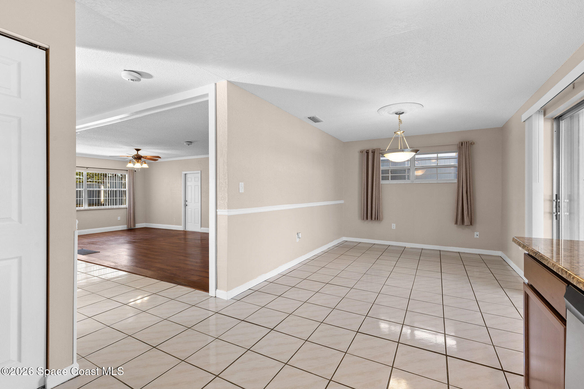 998 Kings Post Road Rockledge, FL 32955 - Photo 10 of 39 a view of an empty room and window