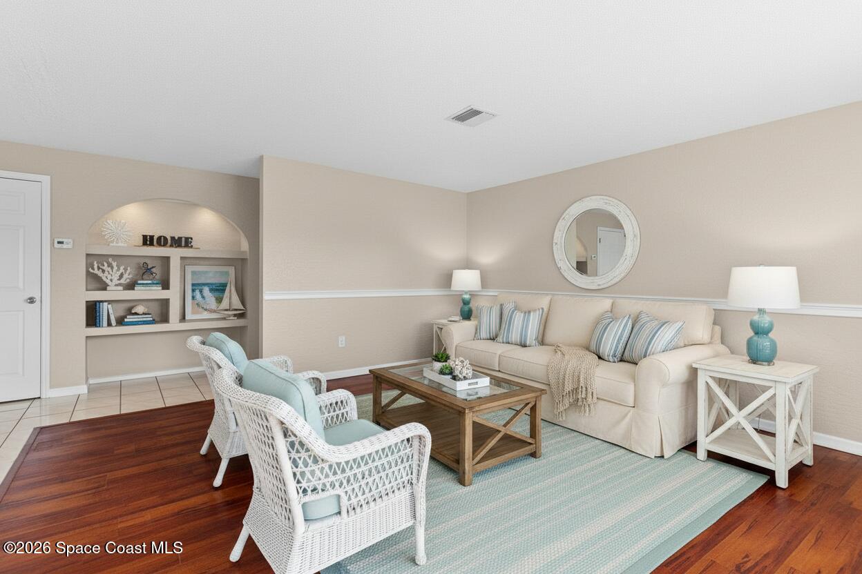 998 Kings Post Road Rockledge, FL 32955 - Photo 13 of 39 a living room with furniture and a wooden floor