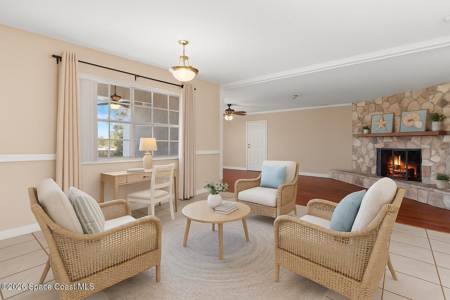 998 Kings Post Road Rockledge, FL 32955 - Photo 15 of 39 a living room with furniture a fireplace and a chandelier