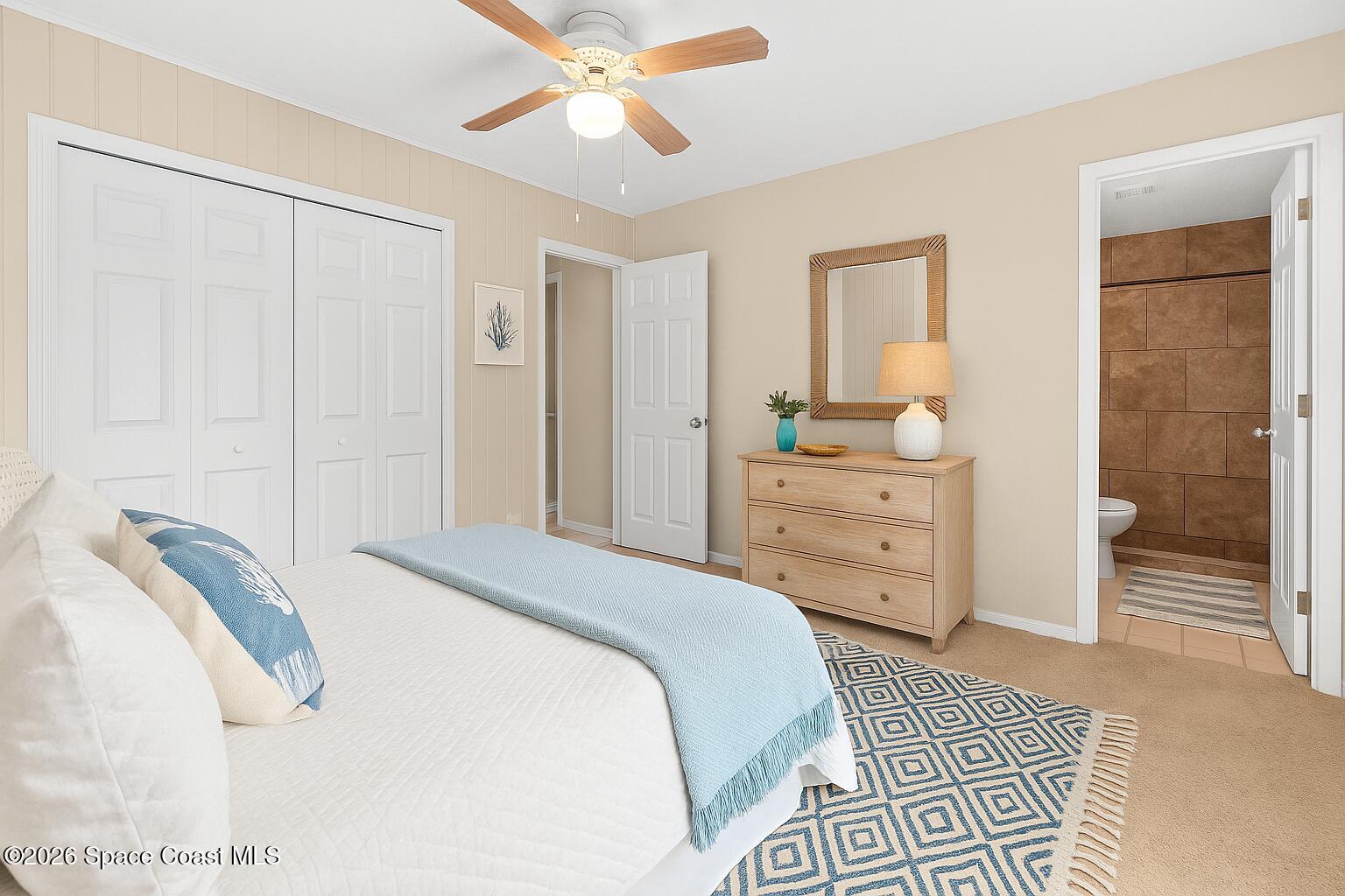998 Kings Post Road Rockledge, FL 32955 - Photo 17 of 39 a bedroom with a bed and a cabinets