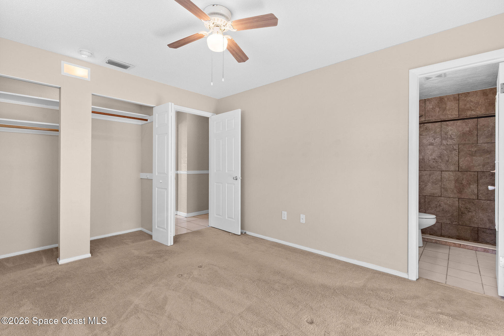 998 Kings Post Road Rockledge, FL 32955 - Photo 18 of 39 a view of an empty room with a bathroom