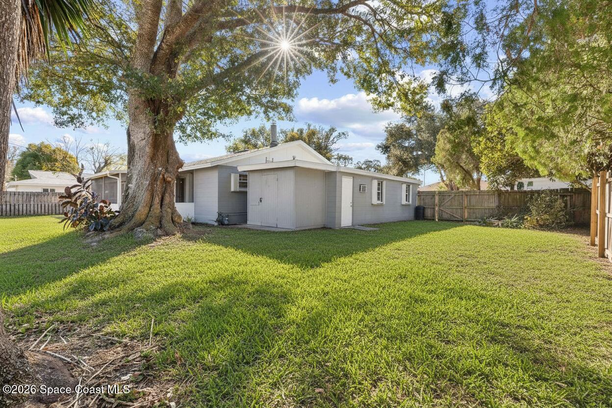 998 Kings Post Road Rockledge, FL 32955 - Photo 2 of 39 a view of a house with a yard