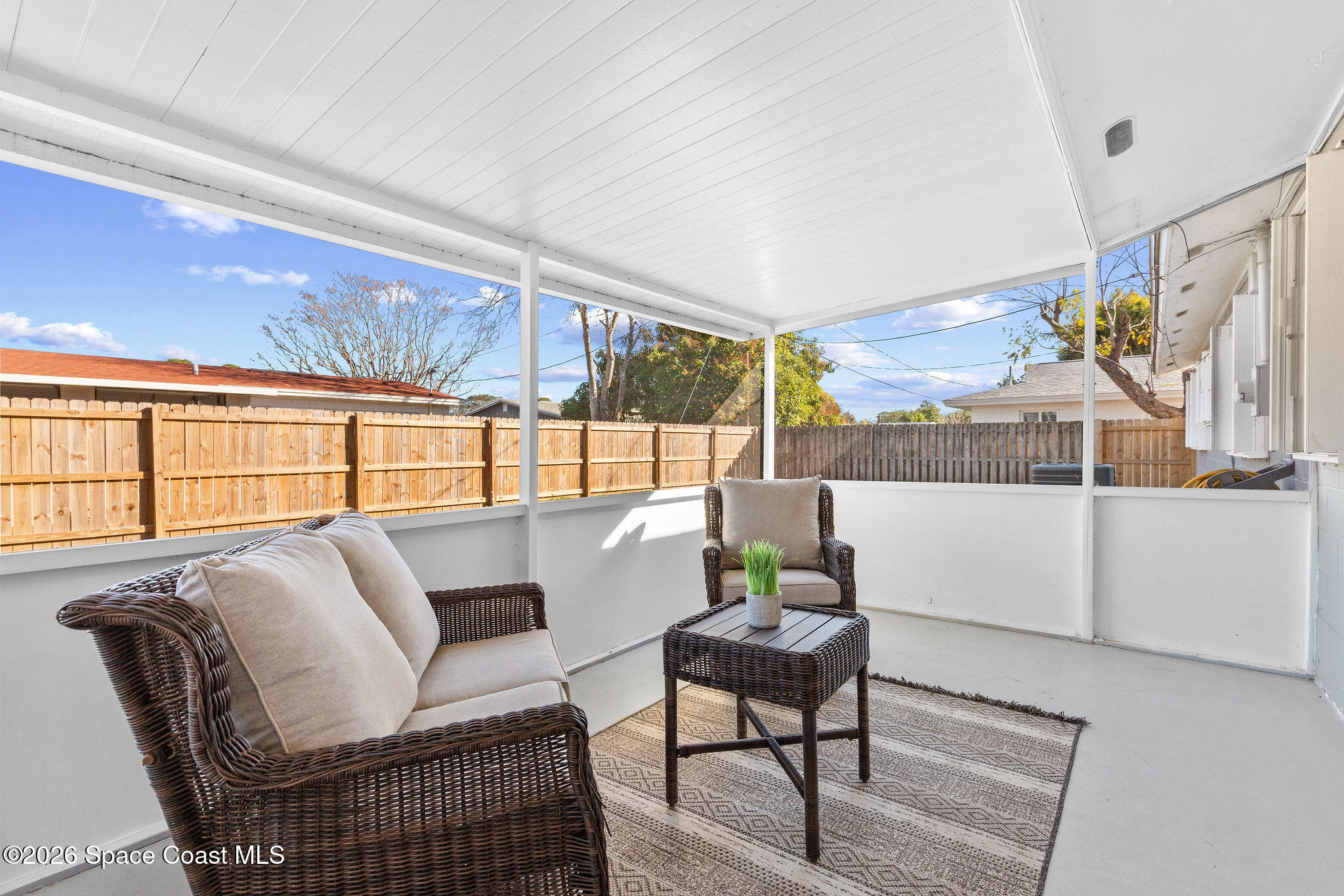 998 Kings Post Road Rockledge, FL 32955 - Photo 25 of 39 a living room with furniture and a large window