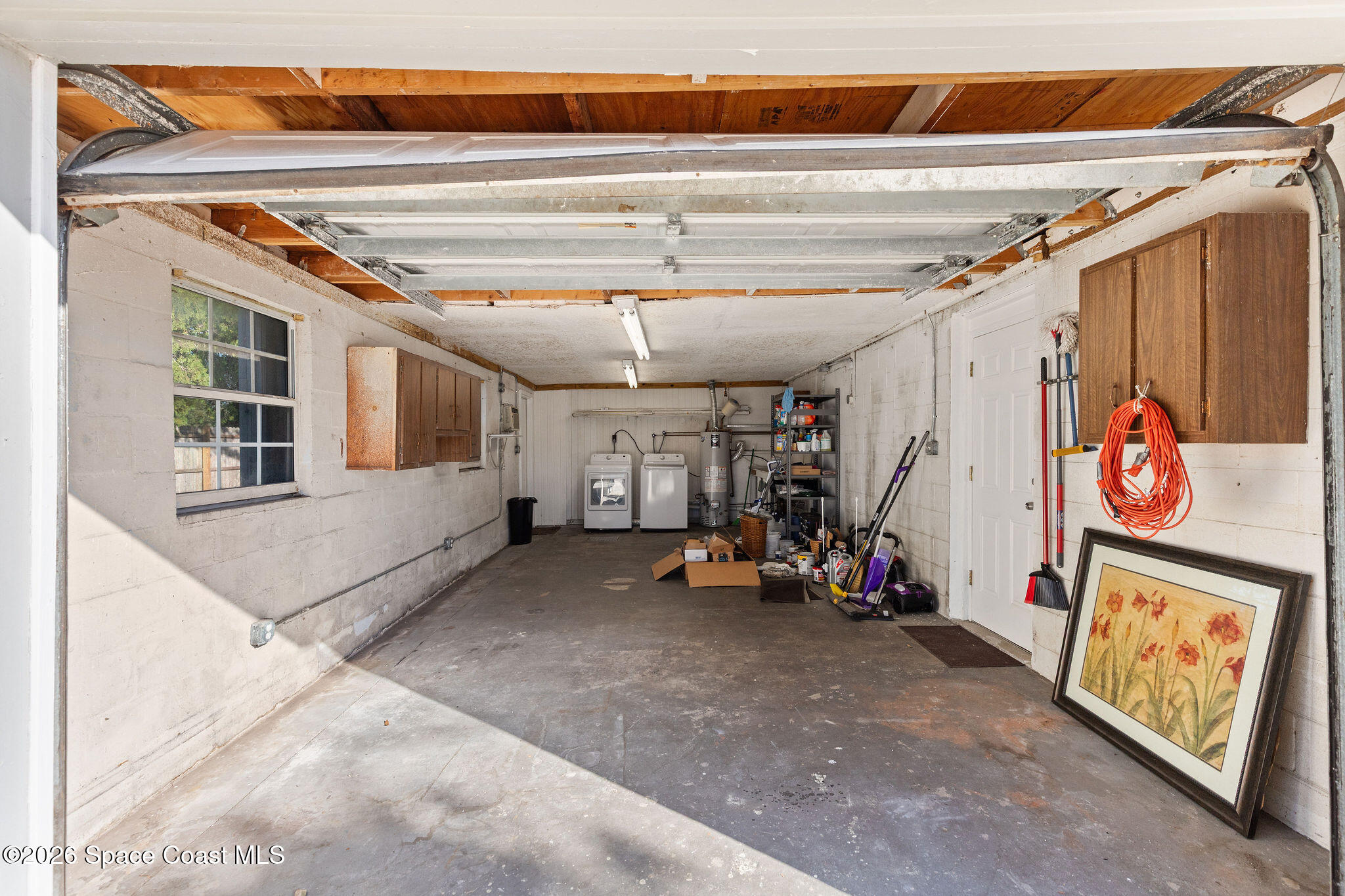 998 Kings Post Road Rockledge, FL 32955 - Photo 34 of 39 a view of a garage with rack and bicycle