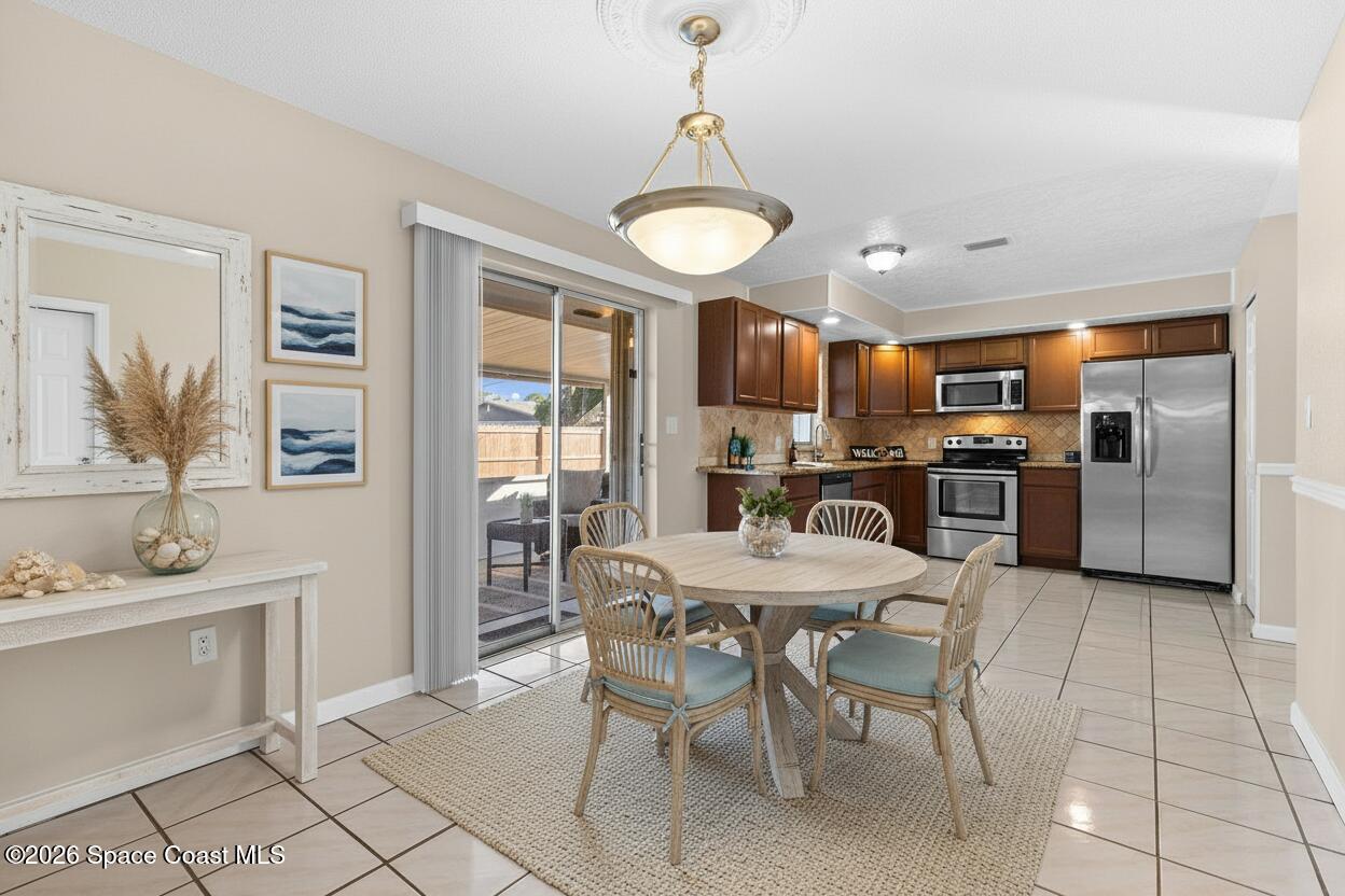 998 Kings Post Road Rockledge, FL 32955 - Photo 6 of 39 a view of a dining room with furniture