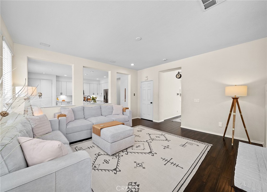 29027 Raintree Lane Saugus, CA 91390 - Photo 11 of 45 a living room with furniture and a wooden floor
