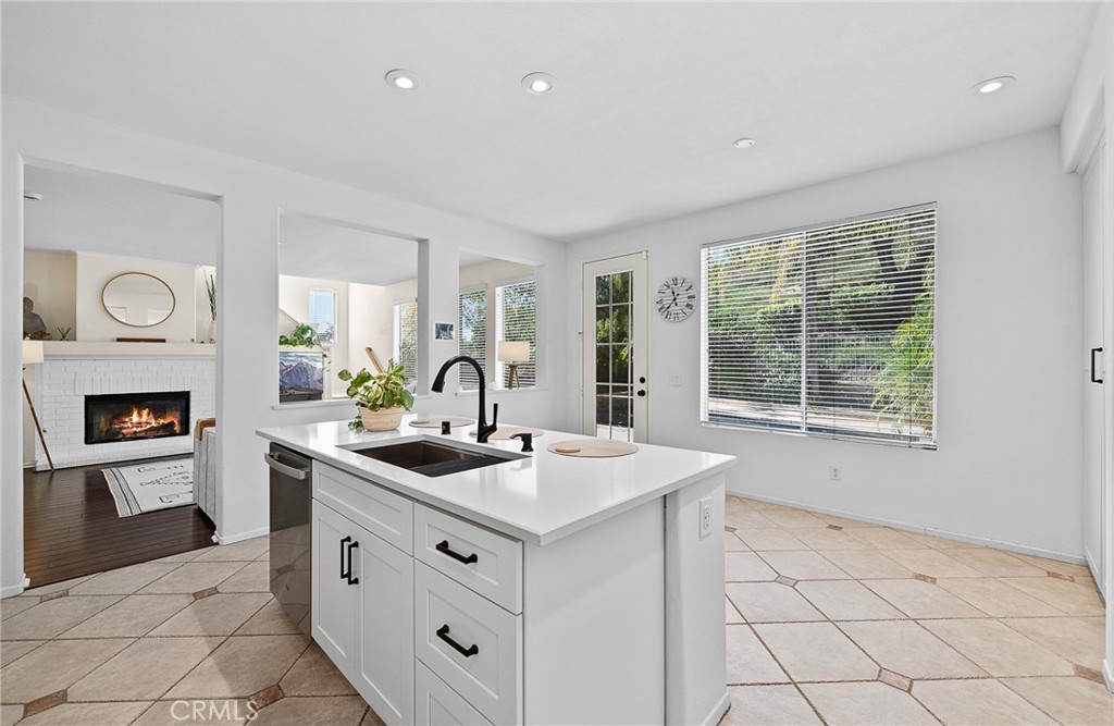 29027 Raintree Lane Saugus, CA 91390 - Photo 15 of 45 a kitchen with a sink and cabinets
