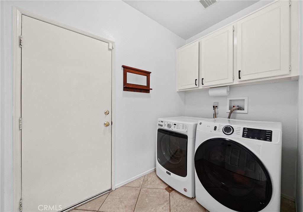 29027 Raintree Lane Saugus, CA 91390 - Photo 21 of 45 a utility room with dryer and washer