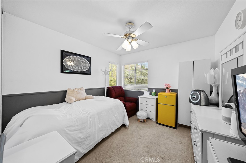 29027 Raintree Lane Saugus, CA 91390 - Photo 35 of 44 a bedroom with a bed and a flat screen tv