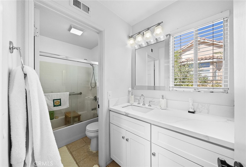 29027 Raintree Lane Saugus, CA 91390 - Photo 35 of 45 a bathroom with a sink a toilet and shower