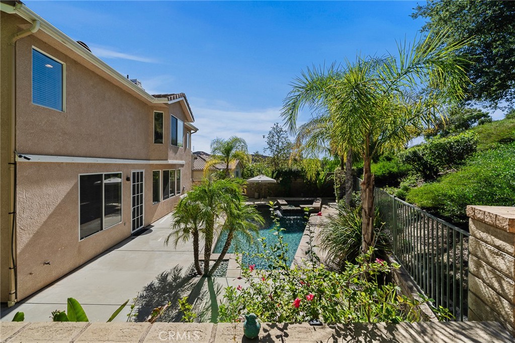 29027 Raintree Lane Saugus, CA 91390 - Photo 41 of 45 a backyard of a house with a garden and plants