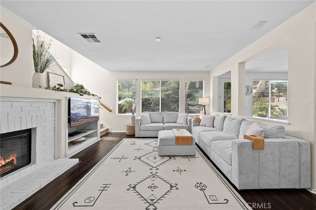 29027 Raintree Lane Saugus, CA 91390 - Photo 10 of 45 a living room with furniture and a fireplace