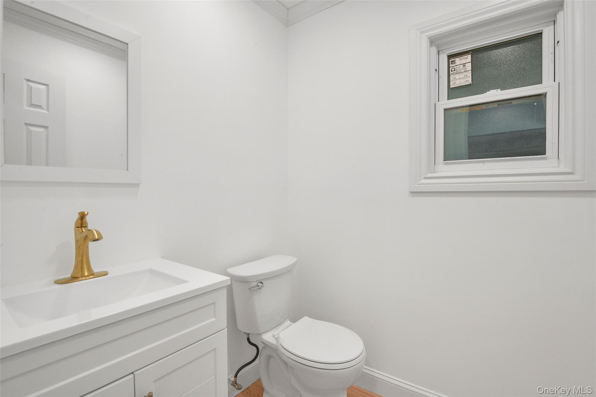26 Ashton Road Yonkers, NY 10705 - Photo 11 of 33 a white toilet sitting next to a bathroom sink