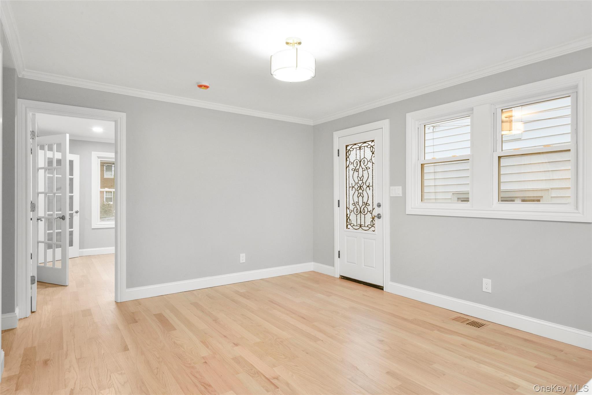 26 Ashton Road Yonkers, NY 10705 - Photo 12 of 33 a view of an empty room with wooden floor and a window