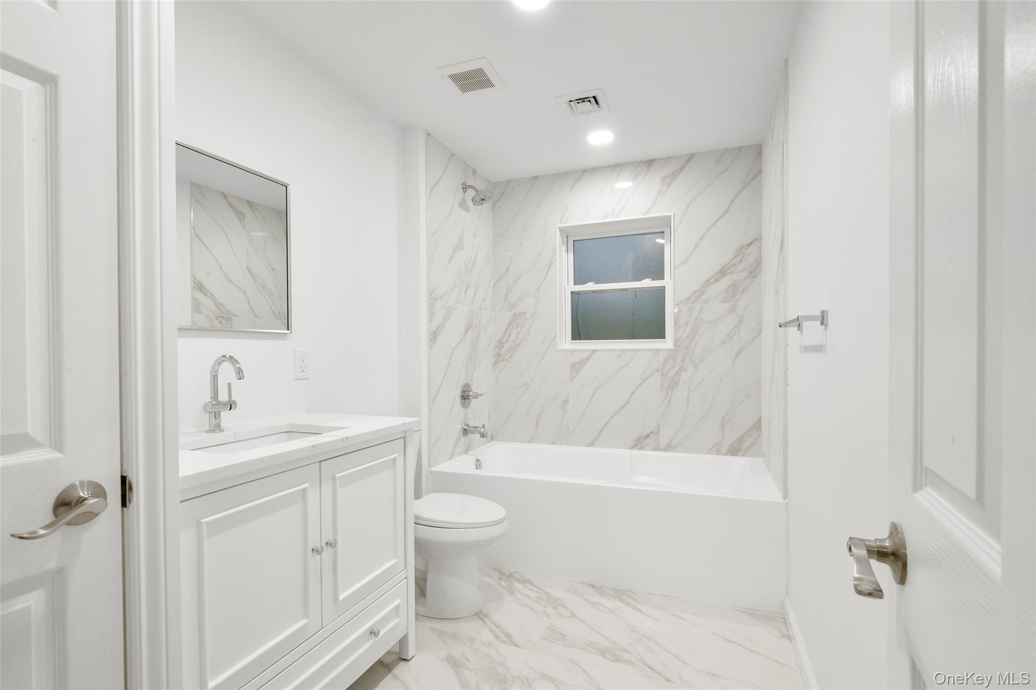 26 Ashton Road Yonkers, NY 10705 - Photo 14 of 33 a bathroom with a bathtub shower sink mirror and toilet