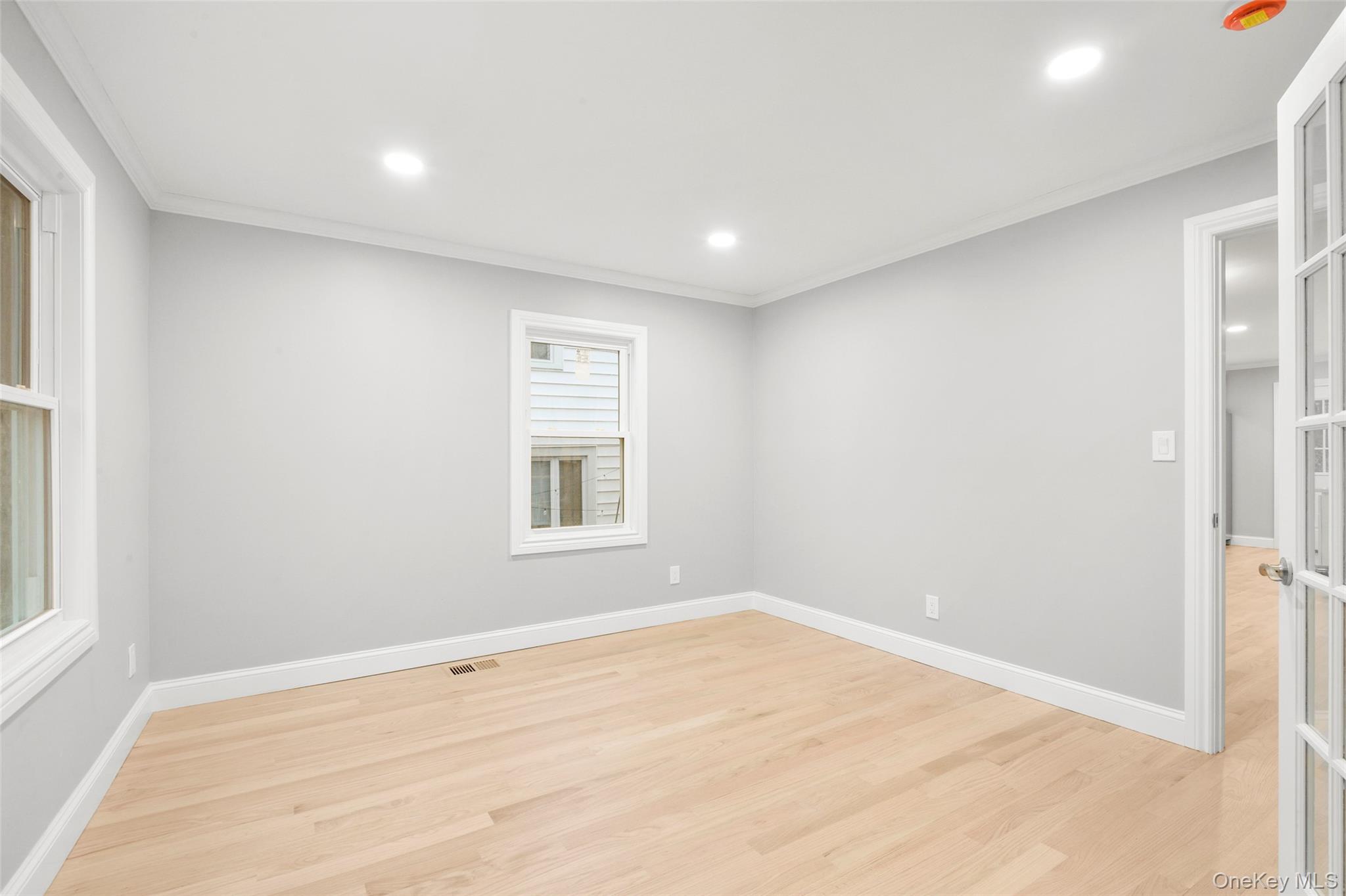 26 Ashton Road Yonkers, NY 10705 - Photo 17 of 33 a view of empty room with wooden floor and fan