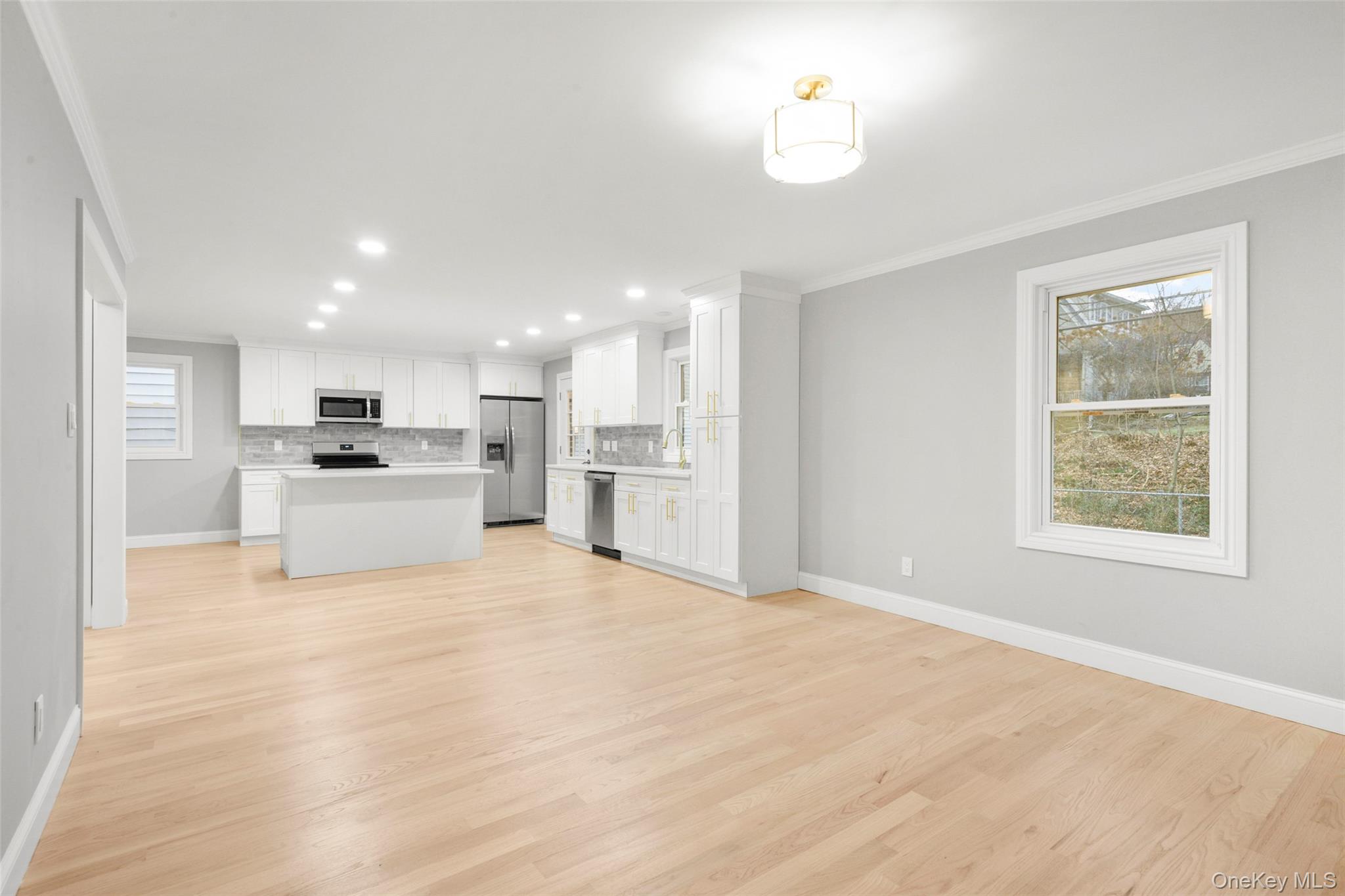 26 Ashton Road Yonkers, NY 10705 - Photo 9 of 33 a view of kitchen with kitchen island wooden floor center island and appliances