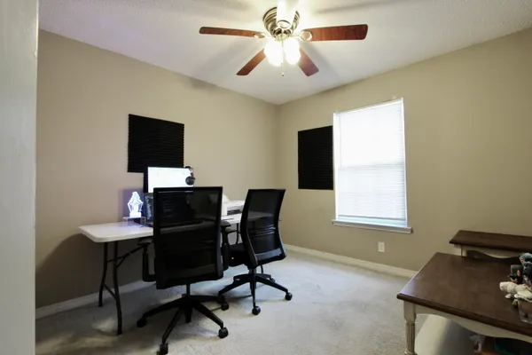 a workspace with furniture and a window