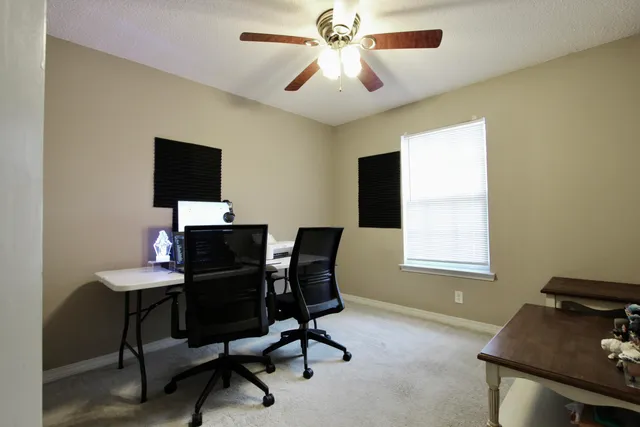 a workspace with furniture and a window