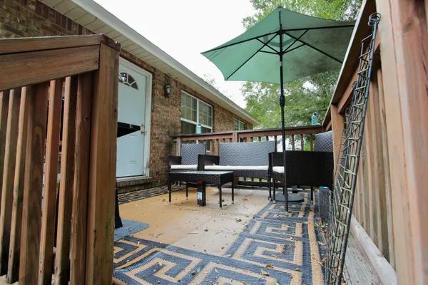 a view of outdoor space deck and outdoor seating