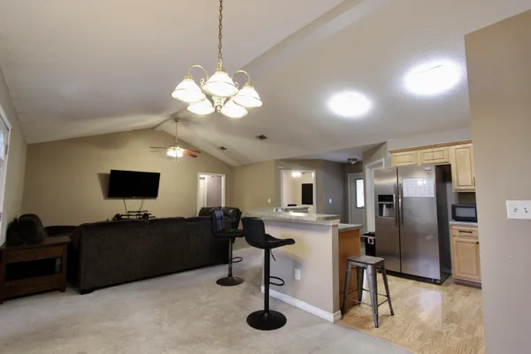 a living room with fireplace furniture and a flat screen tv