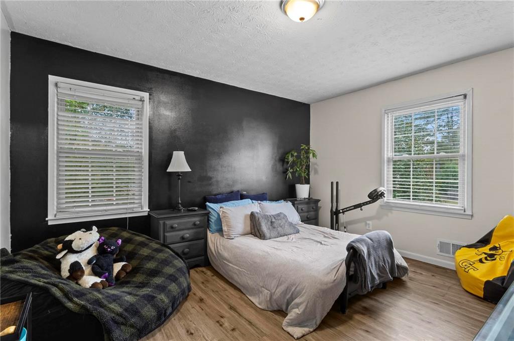 4593 Mars Court Acworth, GA 30101 - Photo 12 of 19 a bedroom with bed and a window