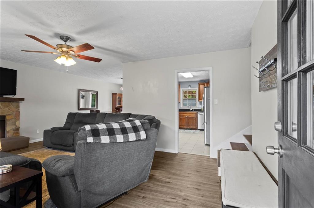 4593 Mars Court Acworth, GA 30101 - Photo 3 of 19 a living room with furniture and a flat screen tv