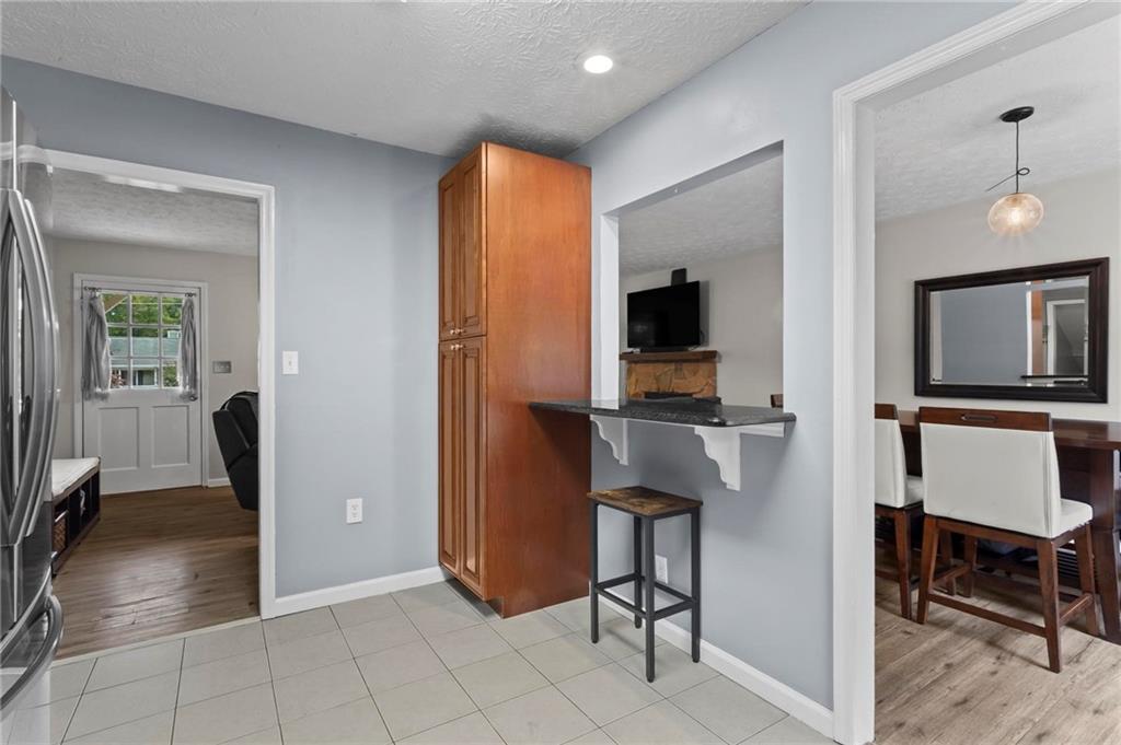 4593 Mars Court Acworth, GA 30101 - Photo 7 of 19 a view of kitchen with furniture and a ceiling fan