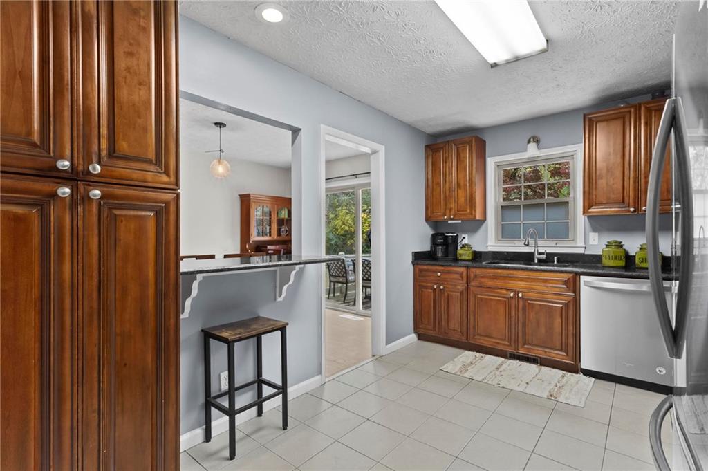 4593 Mars Court Acworth, GA 30101 - Photo 9 of 19 a kitchen with stainless steel appliances granite countertop a refrigerator and sink