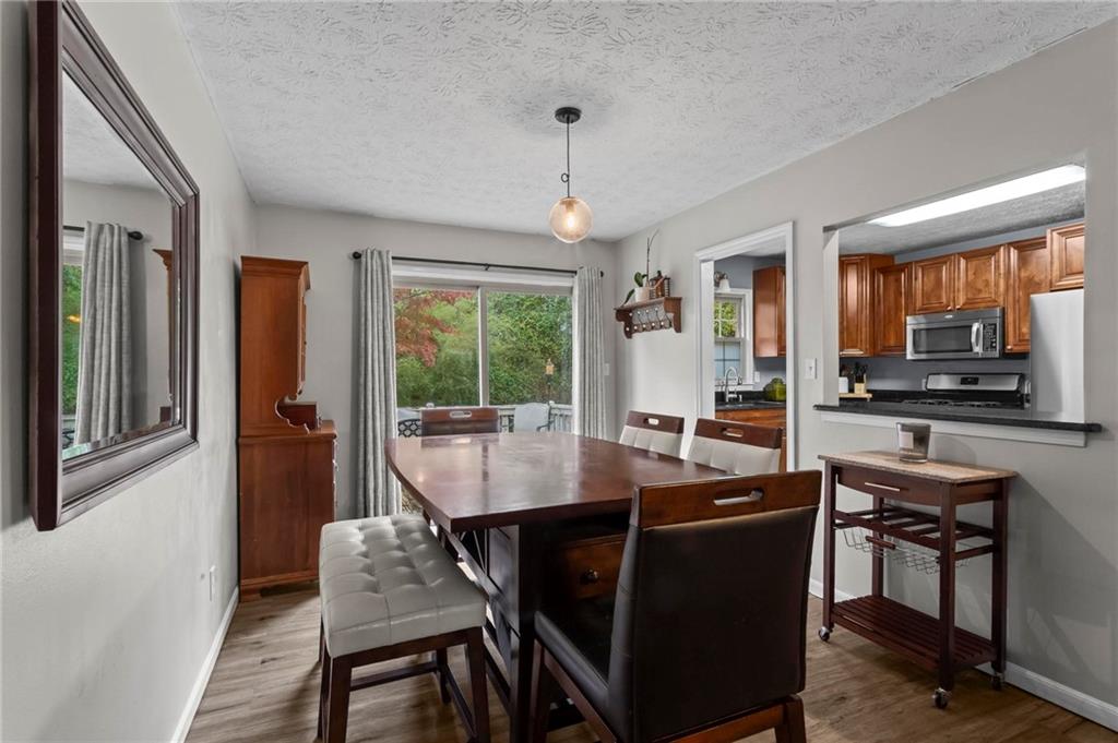 4593 Mars Court Acworth, GA 30101 - Photo 10 of 19 a view of a dining room with furniture window and outside view